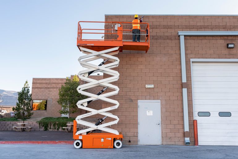 A scissor lift being used for vertical access.