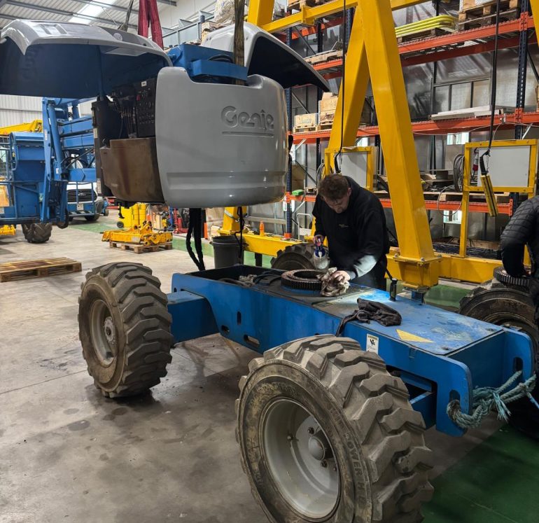 A slew ring being repaired on a large boom lift.