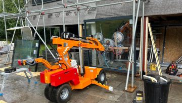 A Smartlift glazing robot on site with Clarkes Glazing.